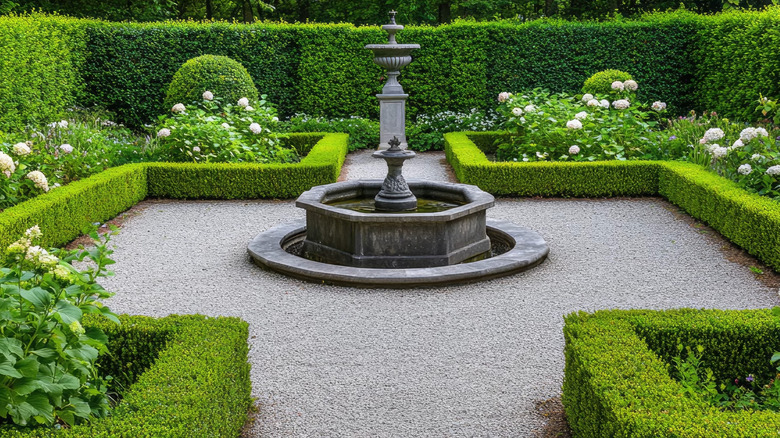 a square formal garden with boxwood hedges
