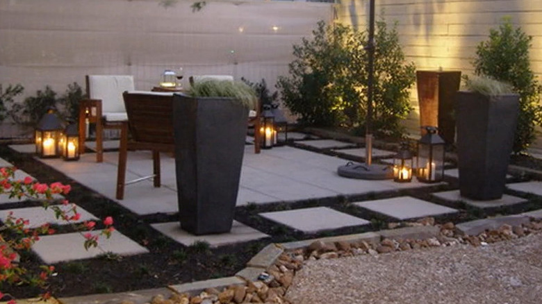 Square concrete pavers in a backyard patio design