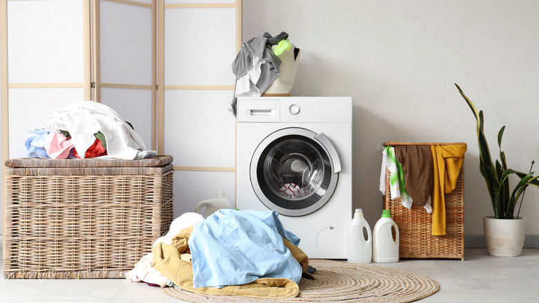 A messy laundry room floor