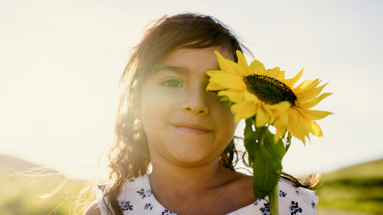 Sunflower and a young girl