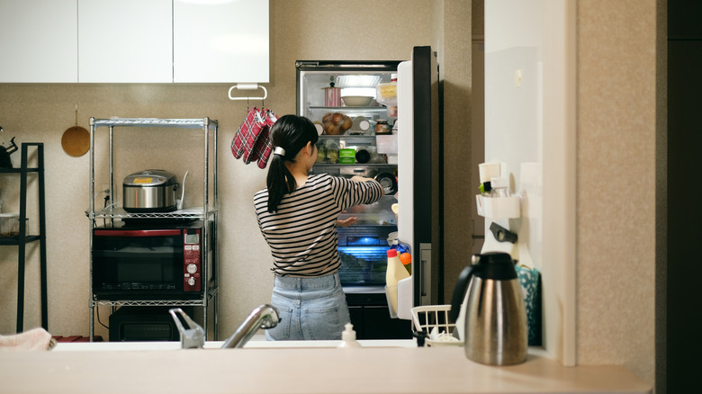 Someone cleaning out their fridge