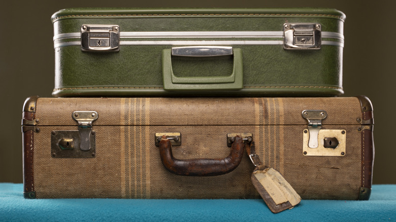 Two stacked vintage suitcases