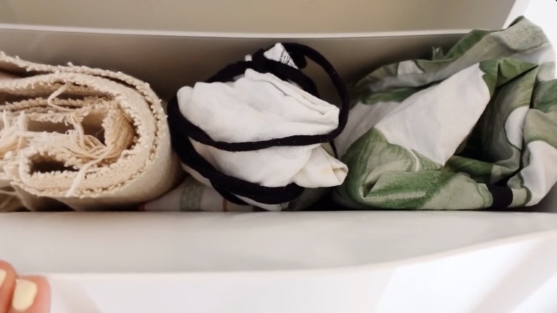 Kitchen towels and decor in a tilt out cabinet