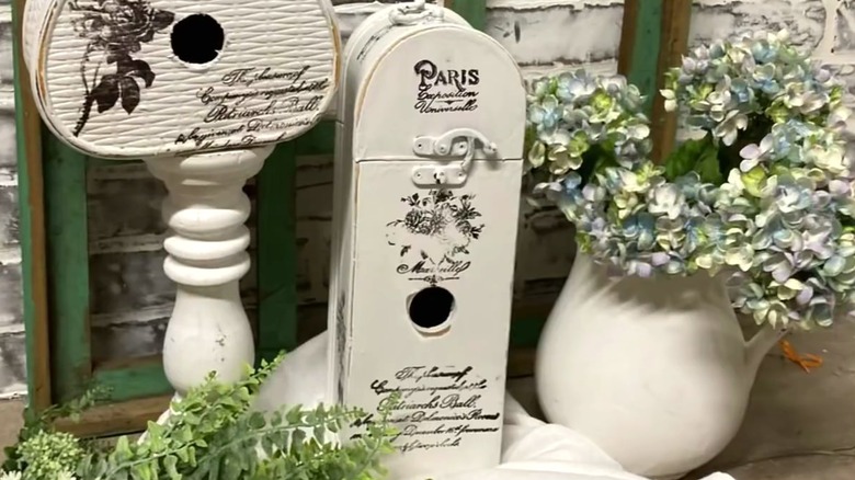 White birdhouses made from secondhand items