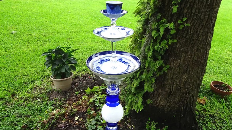 DIY tiered birdbath made from vintage dishes