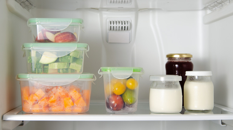 Vegetables and milk organized in fridge