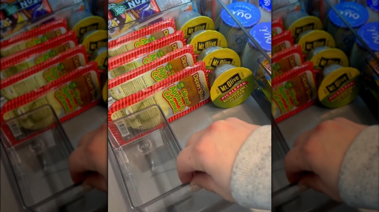 A person restocking snack drawer