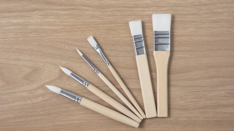 Customer image of assorted wood brushes on wood table