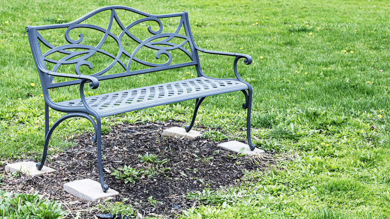 outdoor bench on cinderblock pavers
