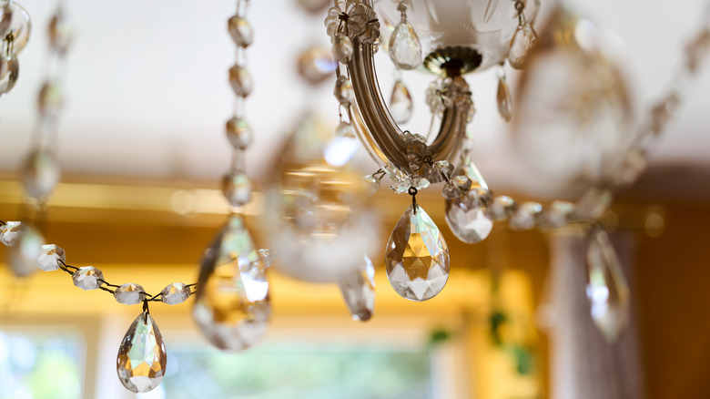 A lighting fixture with dripping crystal accents
