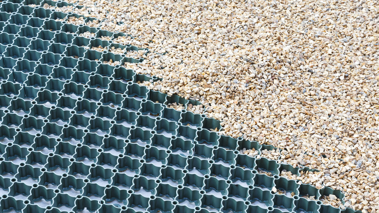 A stabilizer grid half-filled with gravel stones