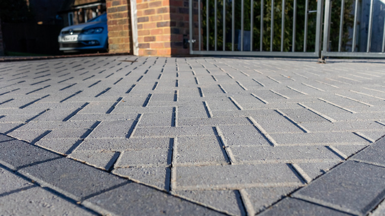 Close-up, low-angle shot of a paver driveway