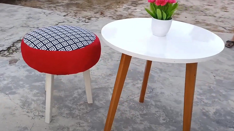 Outdoor tire stool with red and geometric pattern