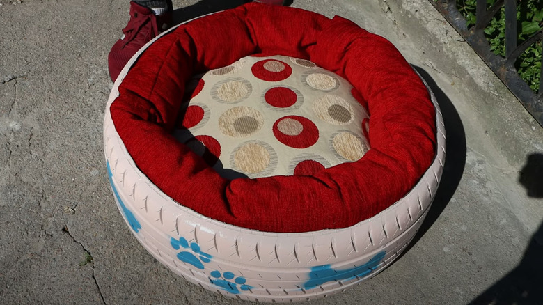 Painted tire transformed into cozy, eccentricpet bed