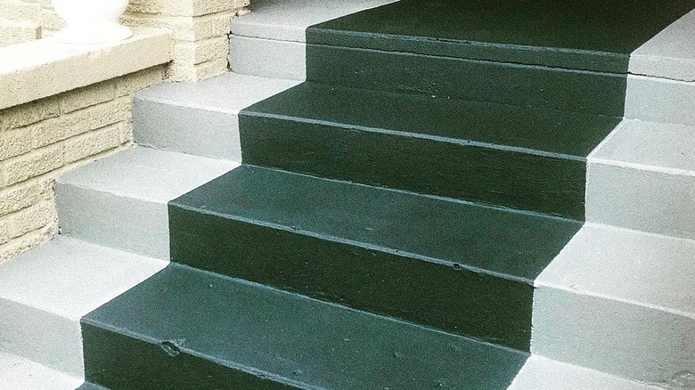 Outside steps painted white with a dark green stripe down the center.