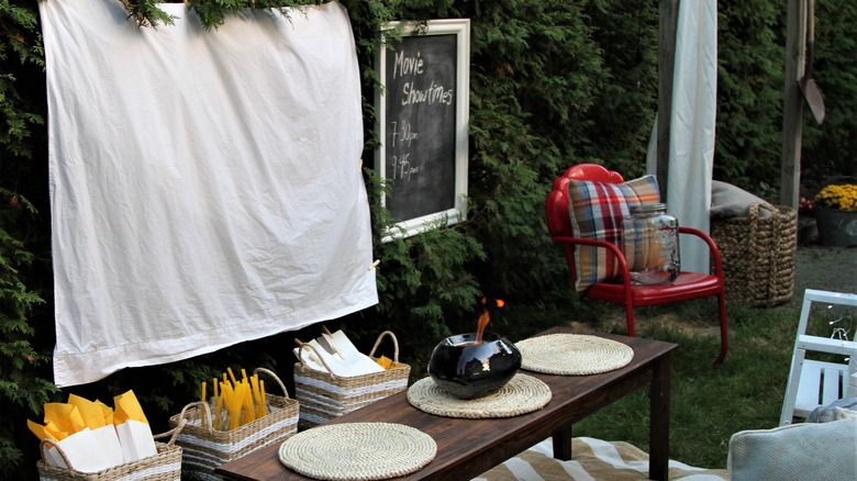 Outdoor cinema with a sheet