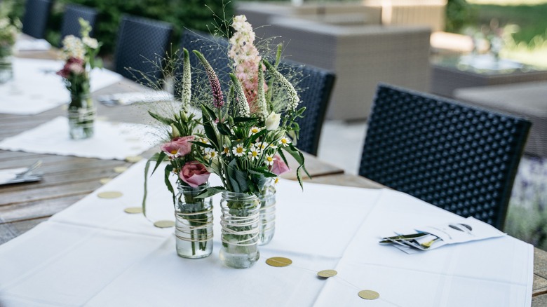 Glass jar centerpiece with flowers