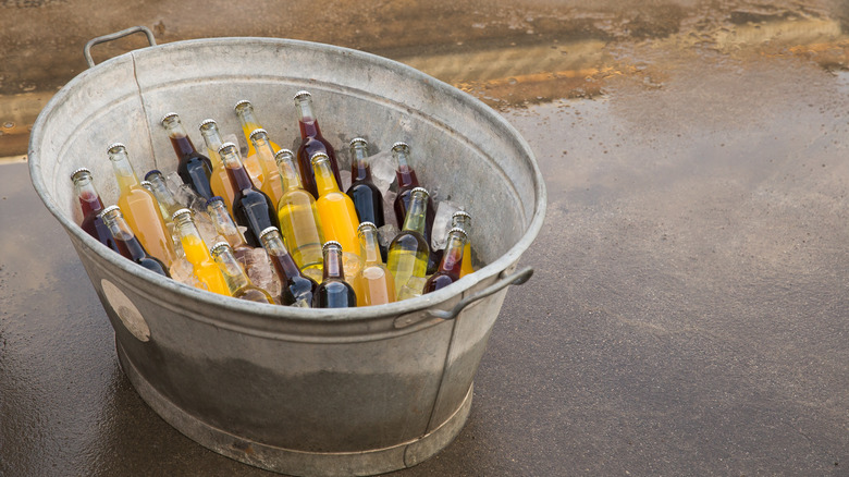 Beverages inside metal washtub