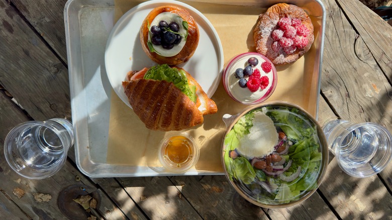 food on silver serving tray on picnic table