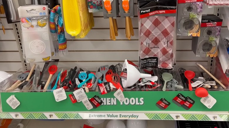 Dollar Tree plastic cooking utensils piled in kitchen department at store