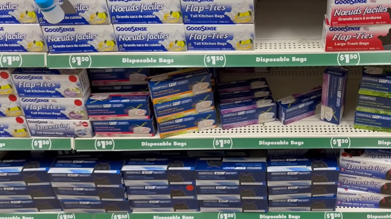 Dollar Tree garbage bag boxes on shelf in store