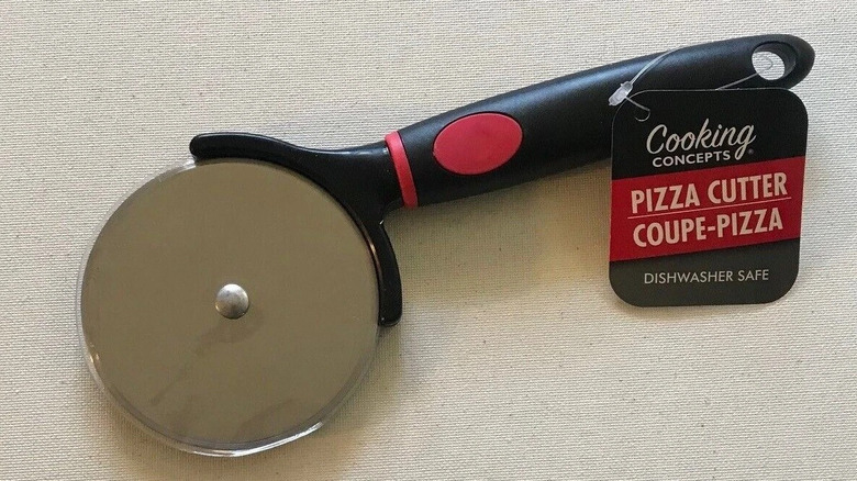 Basic Cooking Concepts pizza cutter on white background