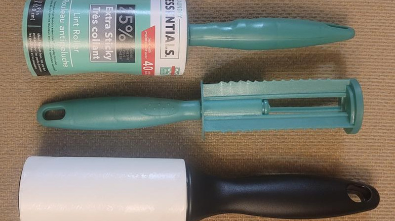 Dollar Tree lint rollers on brown fabric beside bare lint roller handle