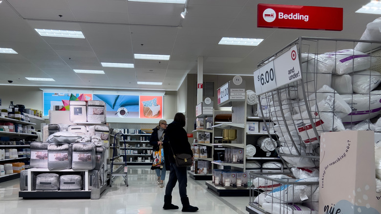 Customers shopping in the home section of a Target store