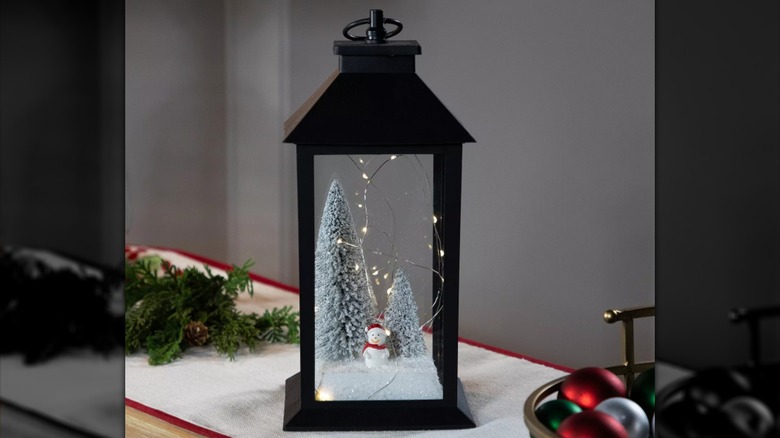 LED lit snowman in a winter scene tabletop lantern