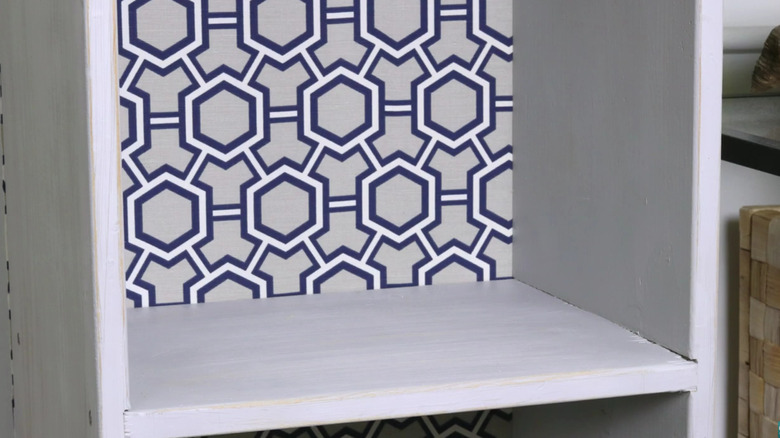 Close-up of hands cutting a piece of fabric