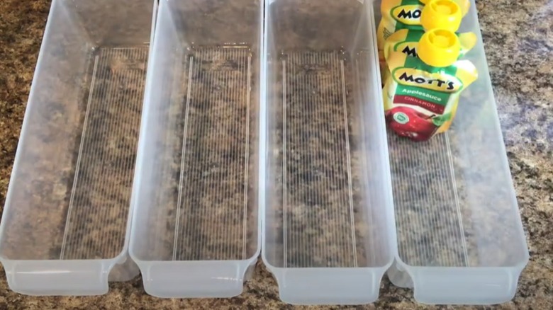 Plastic trays are ready to be filled with snacks.