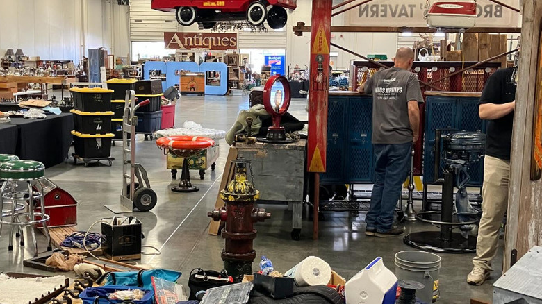 A view of inside Junk Bonanza with men shopping for antiques.
