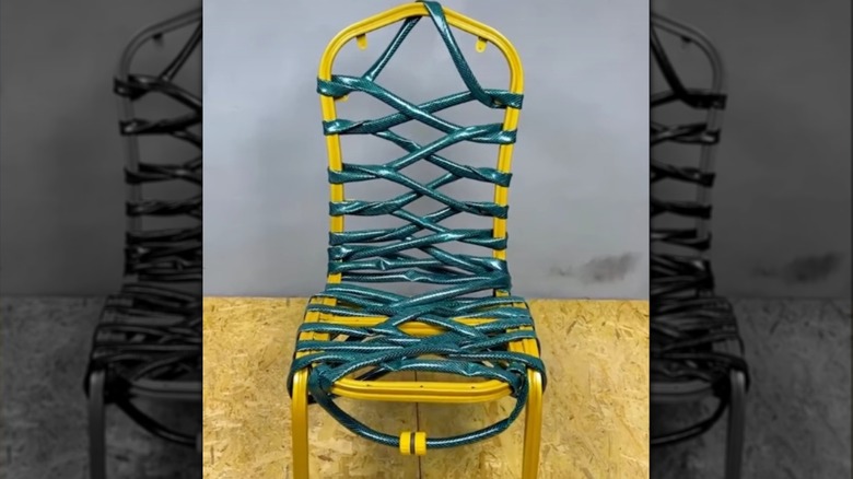 Yellow chair frame with the seat made from an old hose