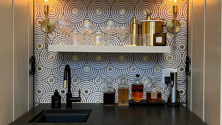 brass inlay tiles combine two different materials within the same backsplash zone