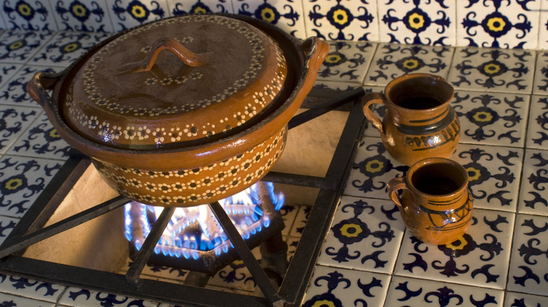 A traditional Mexican kitchen with tiled backsplash and counter