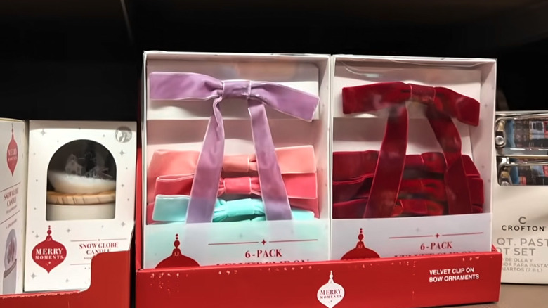 Someone holding Aldi's velvet clip-on bows