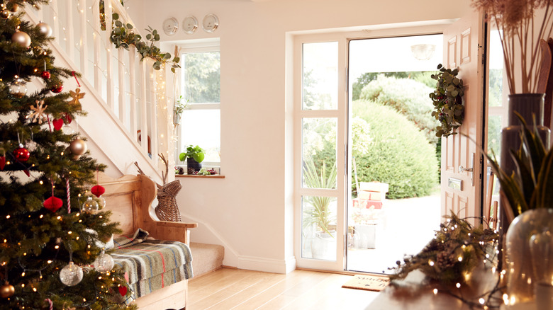 The entryway of a home that's decorated for Christmas
