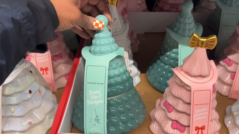 Aldi's pine and eucalyptus candle, which is shaped like a Christmas tree