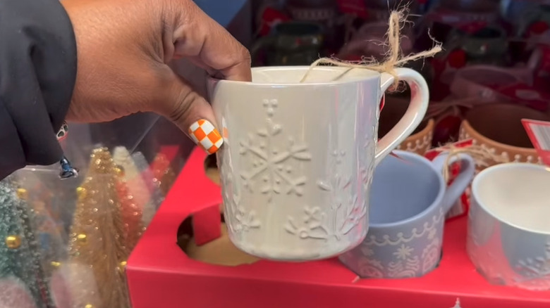 A product image of Aldi's white, embossed snowflake mug