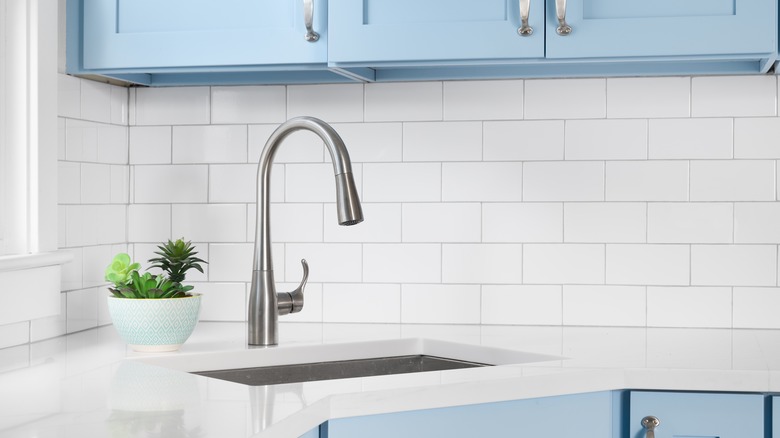 blue cabinets and white countertops