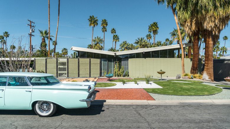 '60s house with blue car