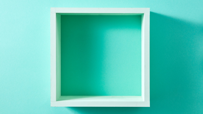 Aqua wall with white box