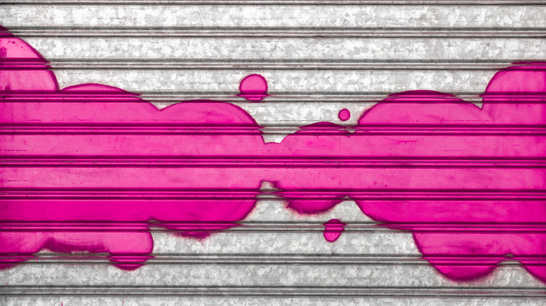Fuchsia graffiti on silver metal