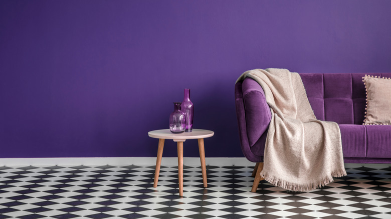 Purple wall with black and white checker floor