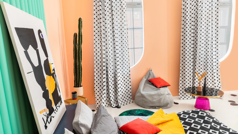 Bedroom with peach wall and bold pattern
