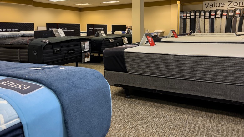 storefront with mattresses on display