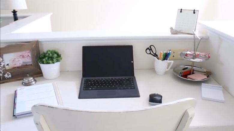 white desk with organized containers