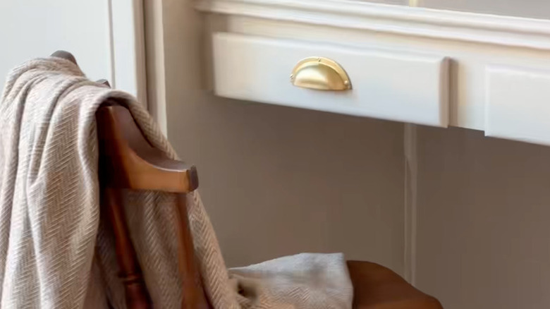 blanket over kitchen desk chair