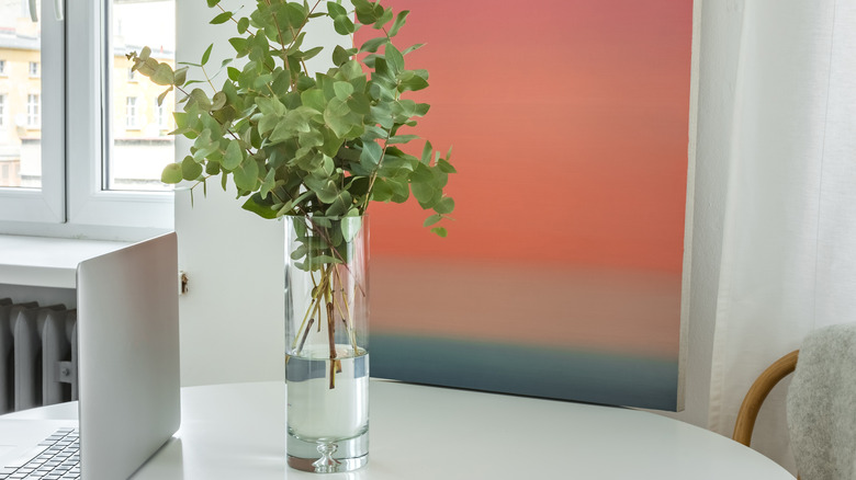 painting by white kitchen table