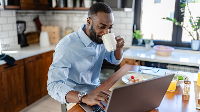 man working at kitchen counter